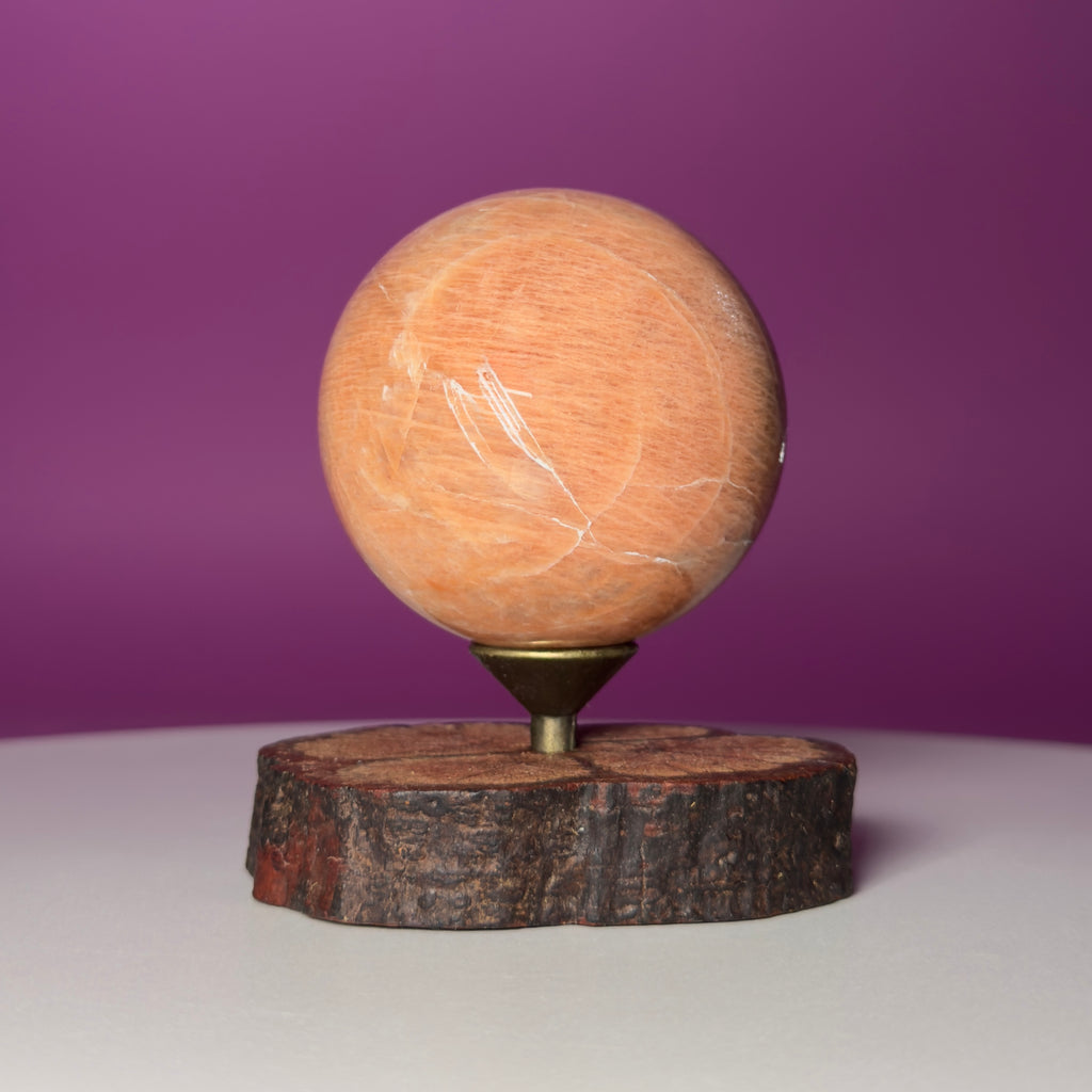 Peach Moonstone Sphere on Decorative Wood Stand