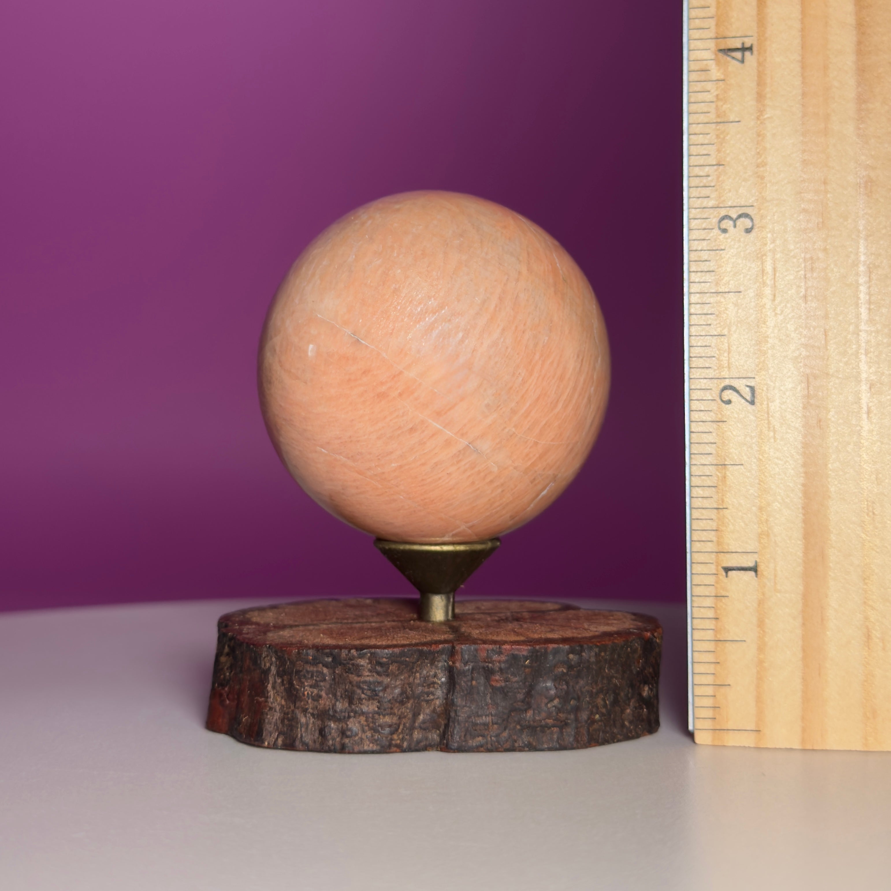 Peach Moonstone Sphere on Decorative Wood Stand