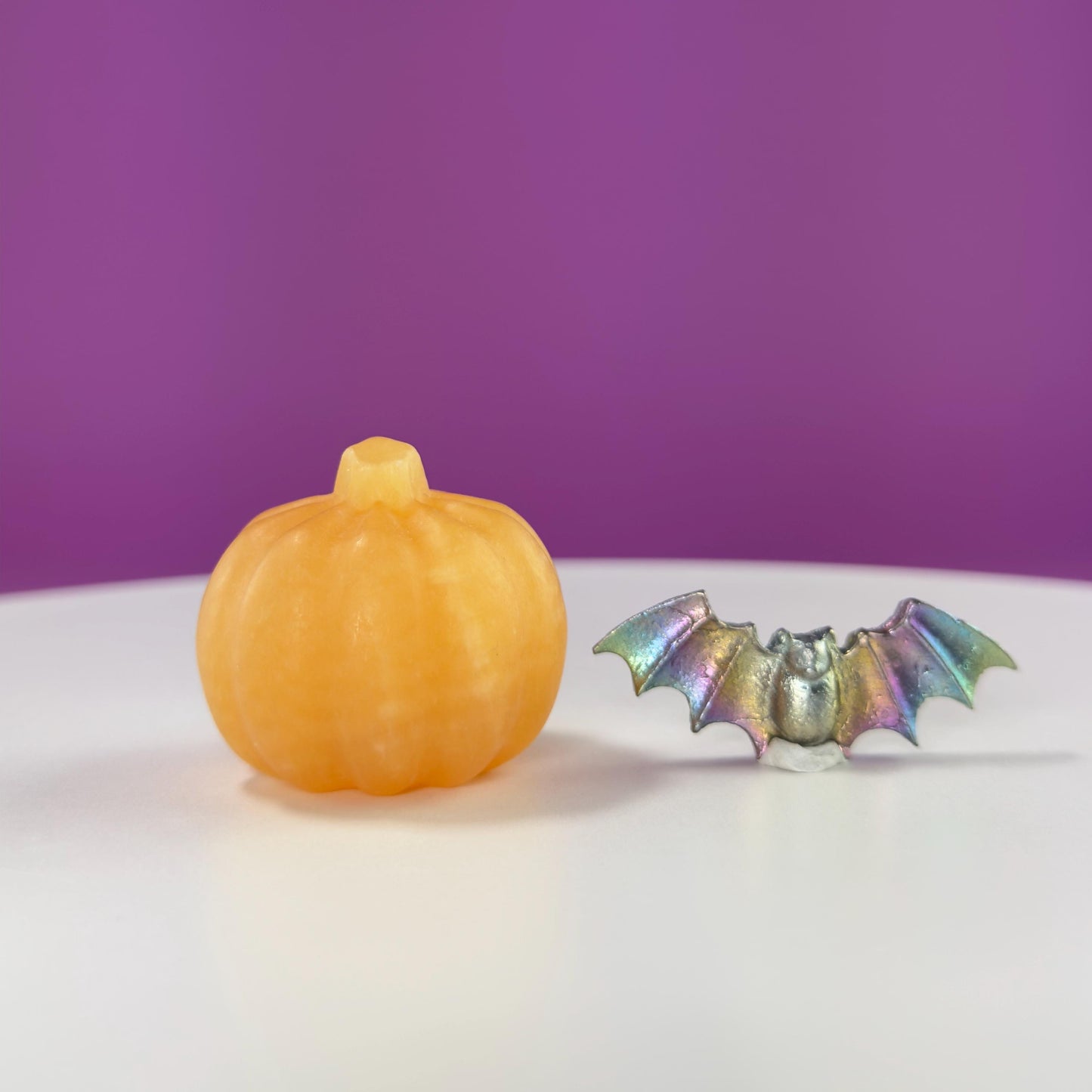 Orange Calcite Pumpkin and Aura Bismuth Bat Carvings