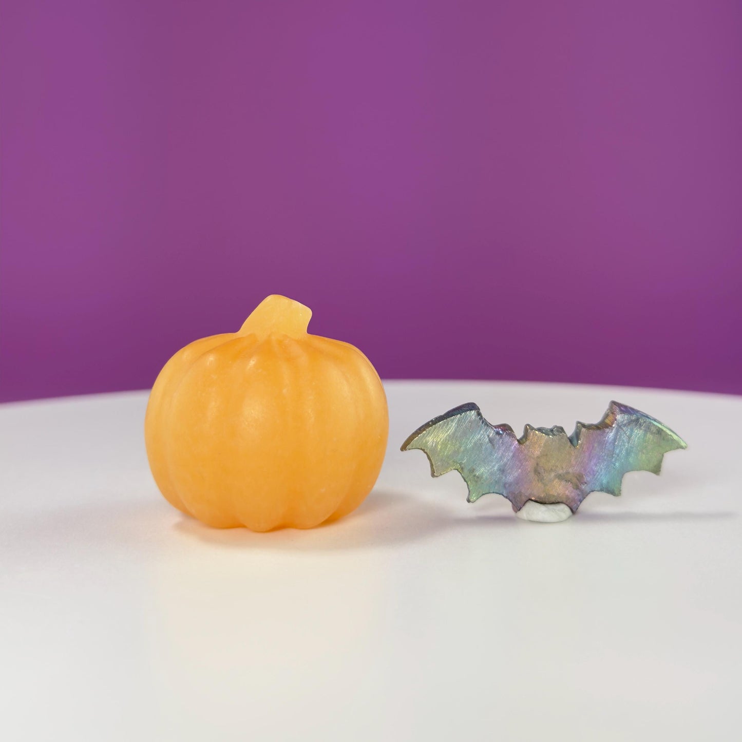 Orange Calcite Pumpkin and Aura Bismuth Bat Carvings