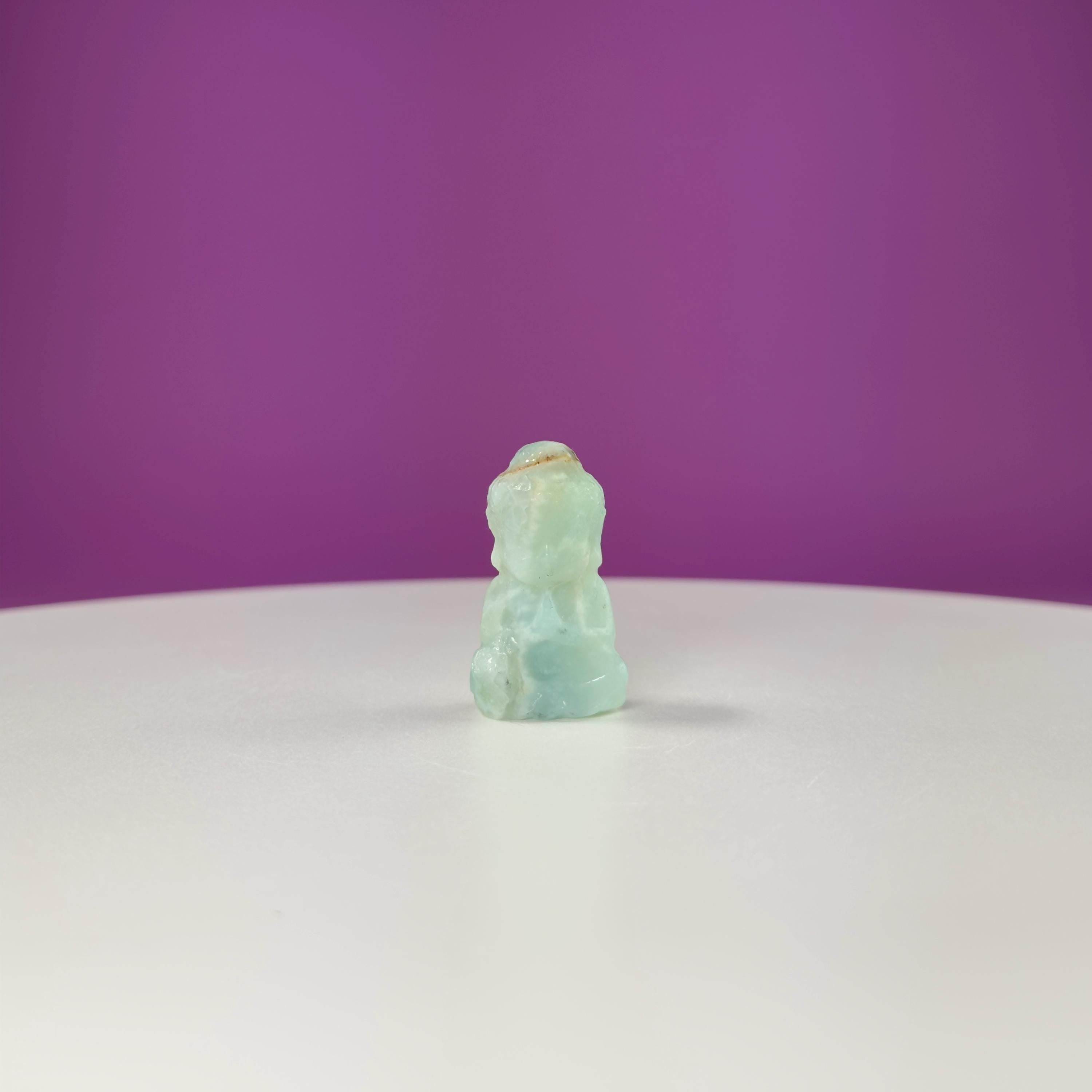 Crystal Baby Buddha Carving: Pocket-Sized Meditation Stone