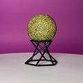 Green Tourmaline Sphere with Black Metal Stand – Protection & Grounding Crystal