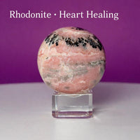 Rhodonite Sphere with Glass Stand – 144g Pink and Black Crystal for Emotional Healing