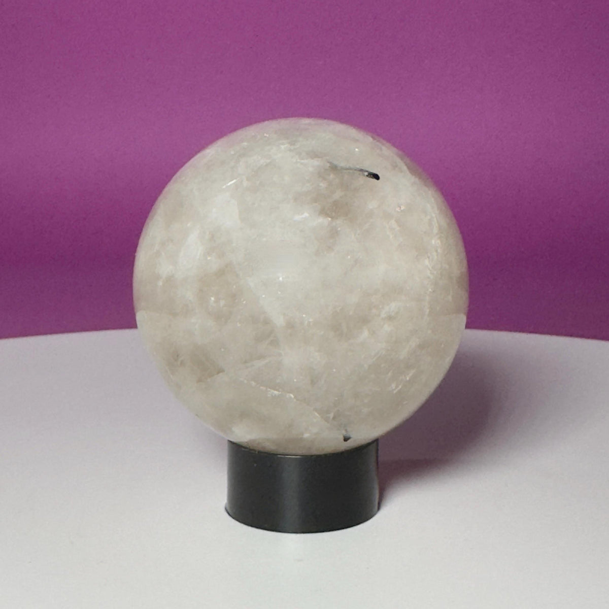 Tourmalinated Quartz Sphere on Black Acrylic Stand