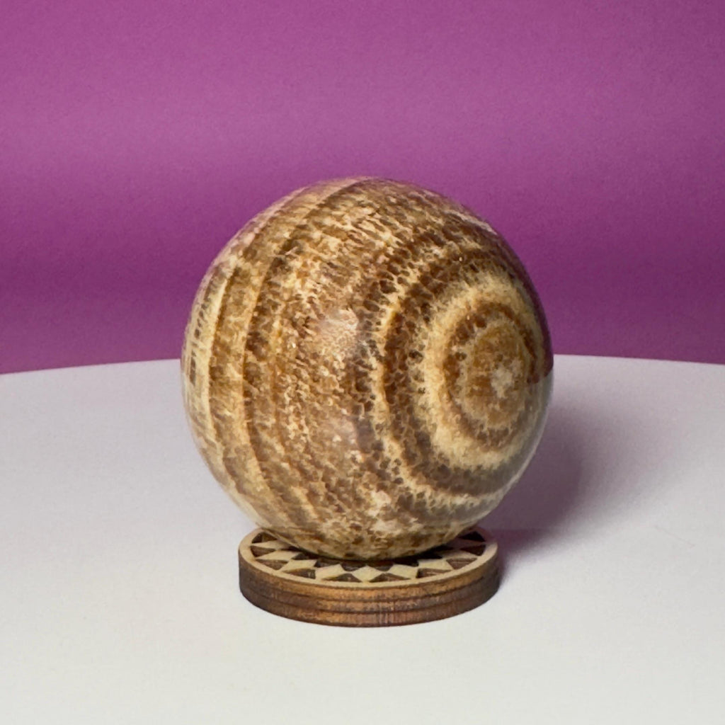 Peruvian Aragonite Sphere with Wood Stand