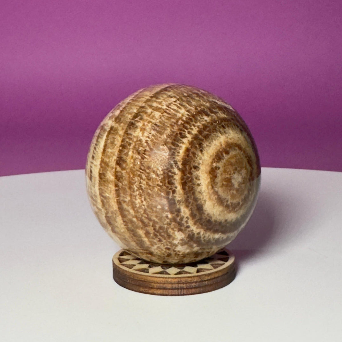 Peruvian Aragonite Sphere with Wood Stand