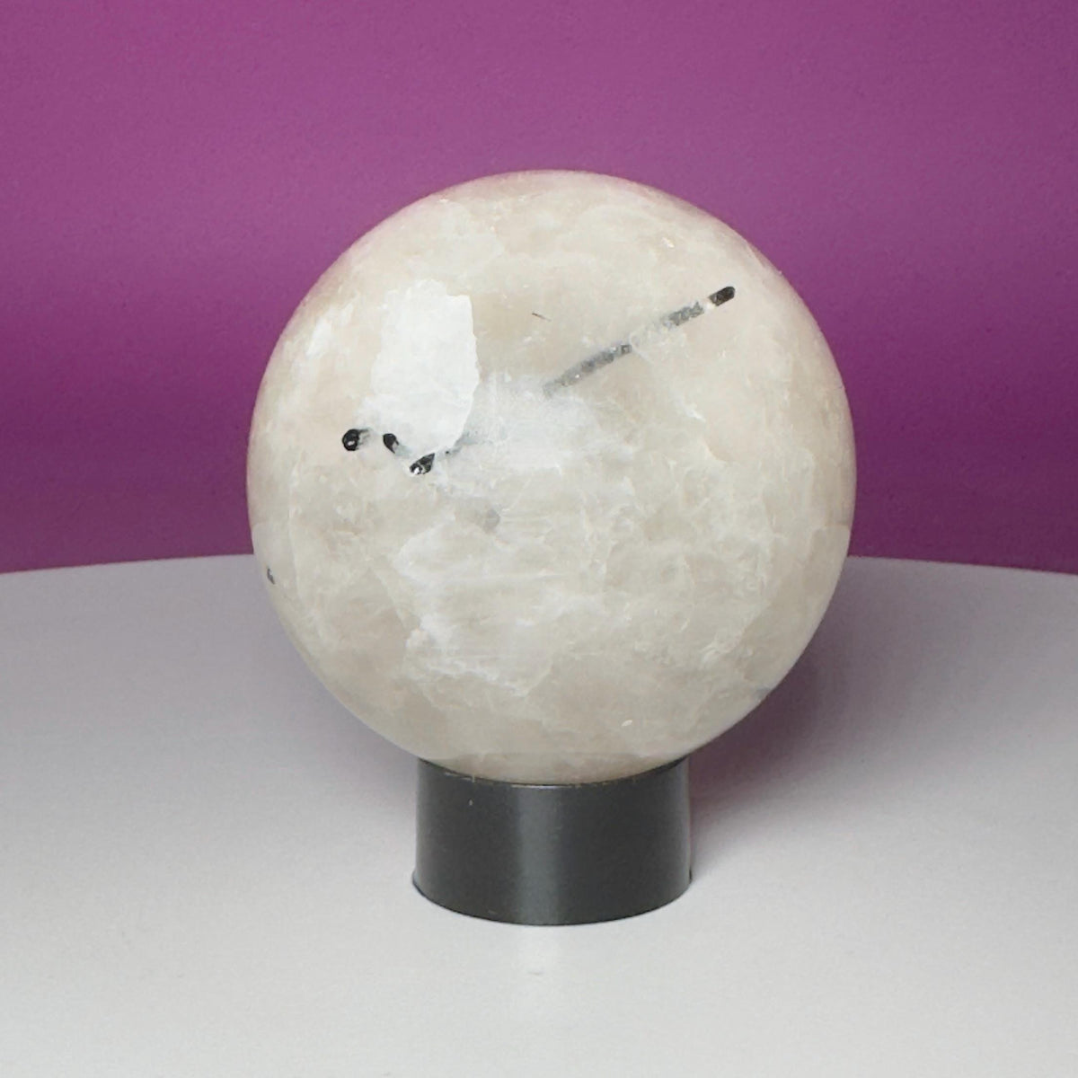 Tourmalinated Quartz Sphere on Black Acrylic Stand