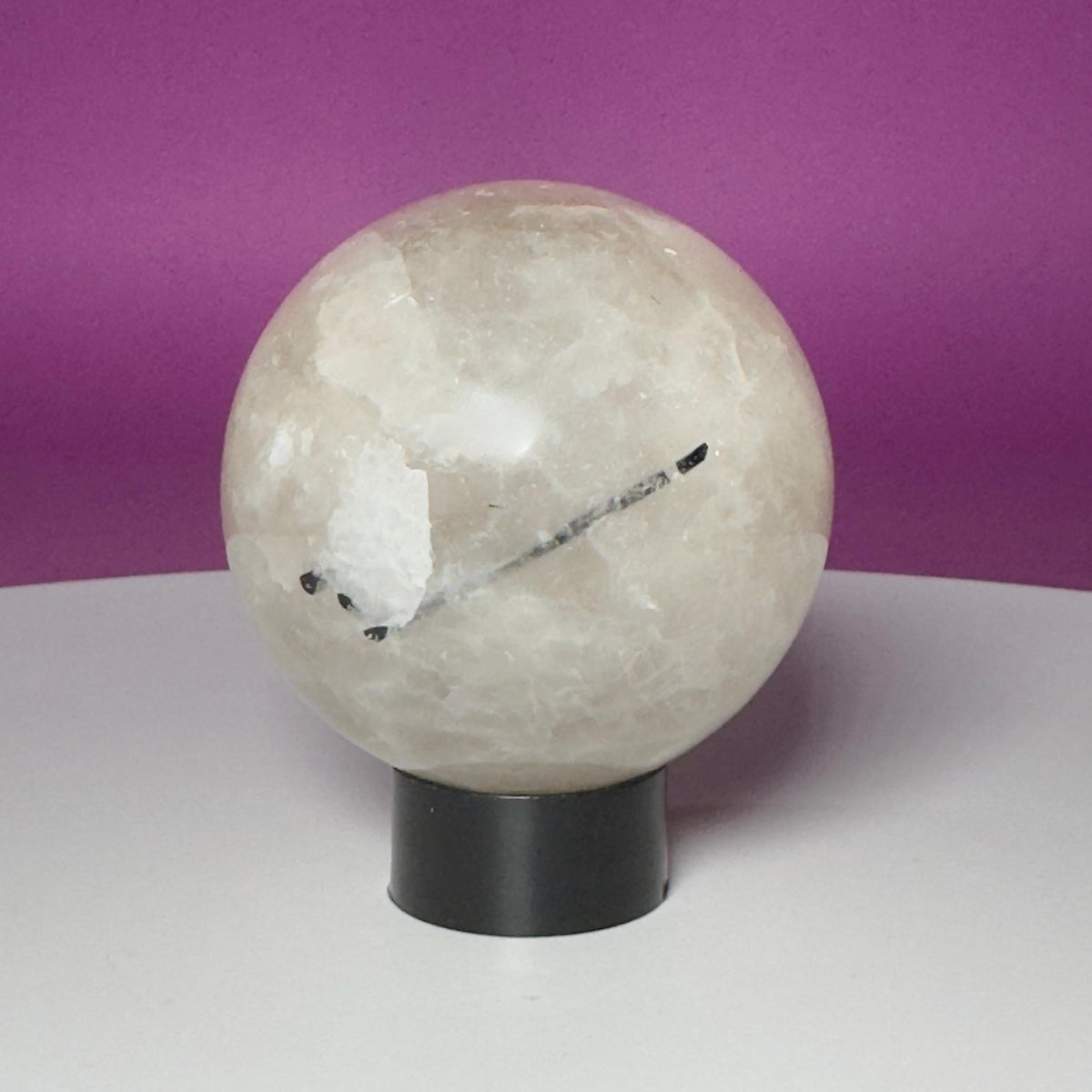 Tourmalinated Quartz Sphere on Black Acrylic Stand