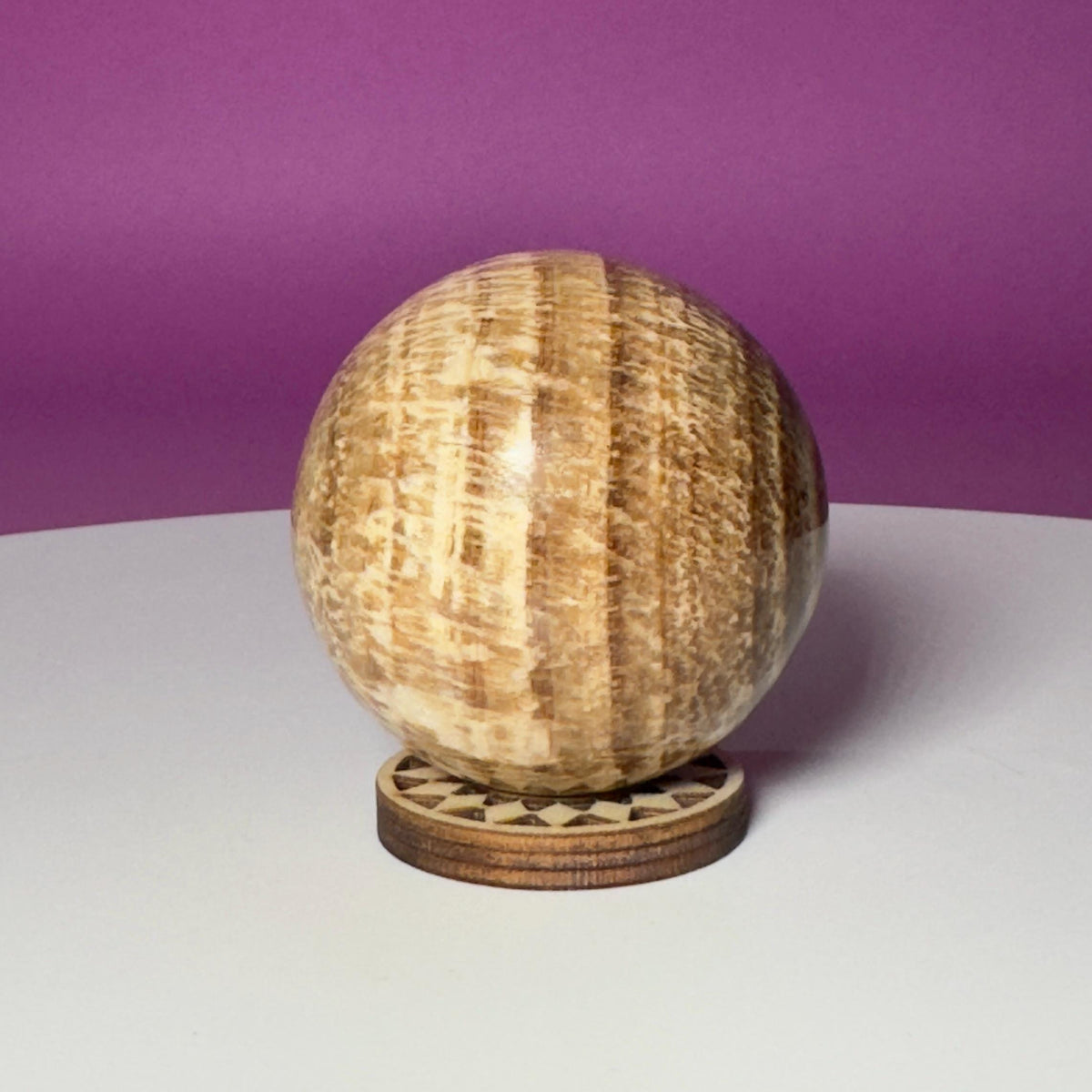 Peruvian Aragonite Sphere with Wood Stand